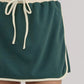 Evergreen Color Contrast Loose Pullover and Lace-up Waist Skort Set